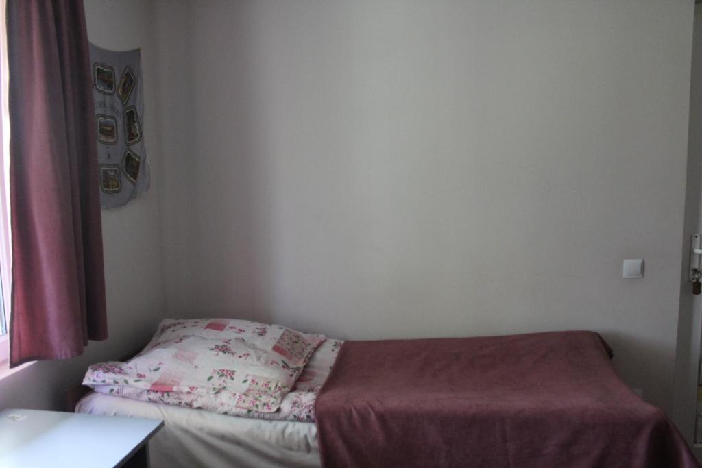 Postel nebo postele na pokoji v ubytování Nunuka House