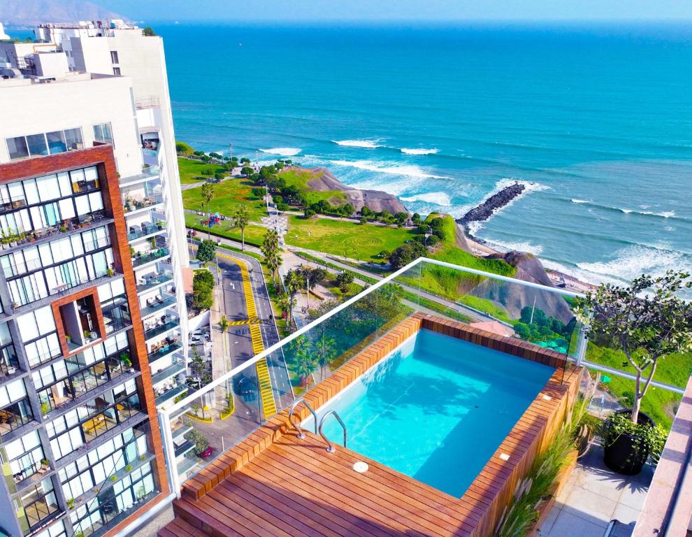 a view of the ocean from a building with a swimming pool at Penthouse Waterfront Private Pool in Lima