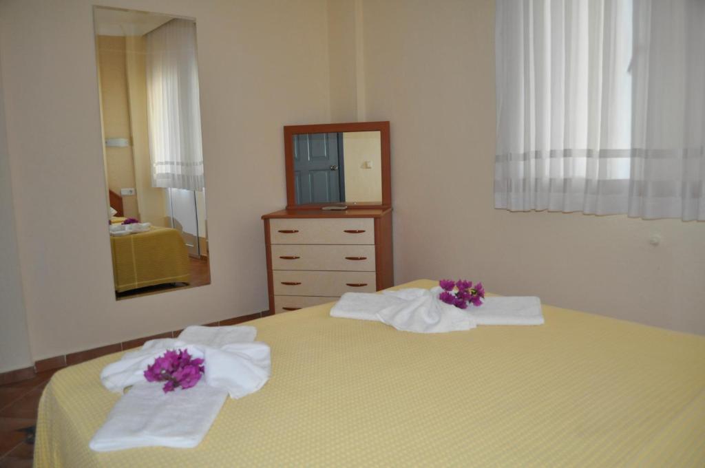 Postel nebo postele na pokoji v ubytování Dogan Apart Hotel