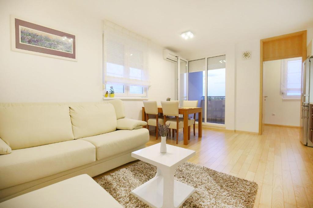 a living room with a couch and a table at Apartment Marty in Zadar