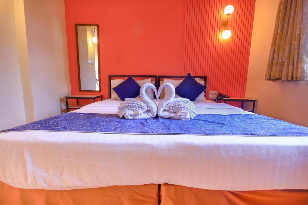Postel nebo postele na pokoji v ubytování Aastha Escape Resort near Calangute Beach