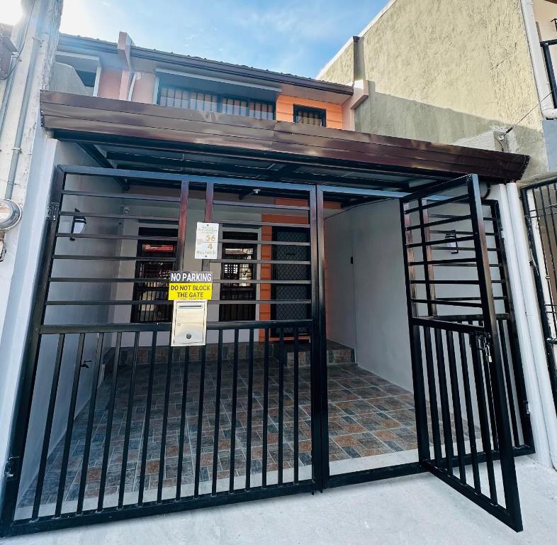 an entrance to a building with a gate at Kimura staycation in Angeles