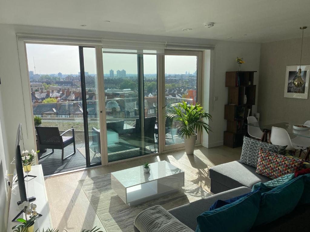 a living room with a view of a city at 7th floor apartment in London