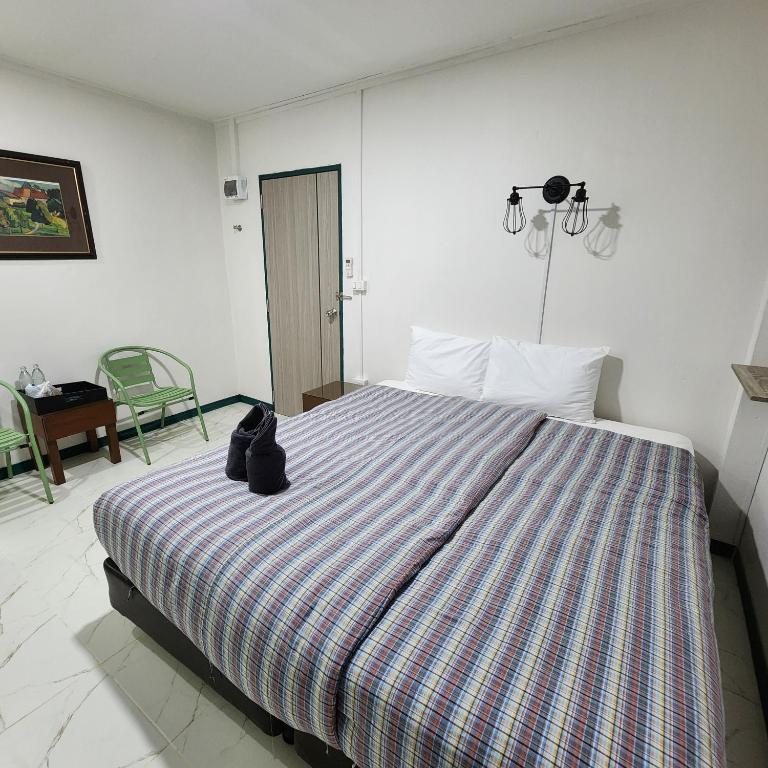 Postel nebo postele na pokoji v ubytování Chandra Home - จันทรา โฮม