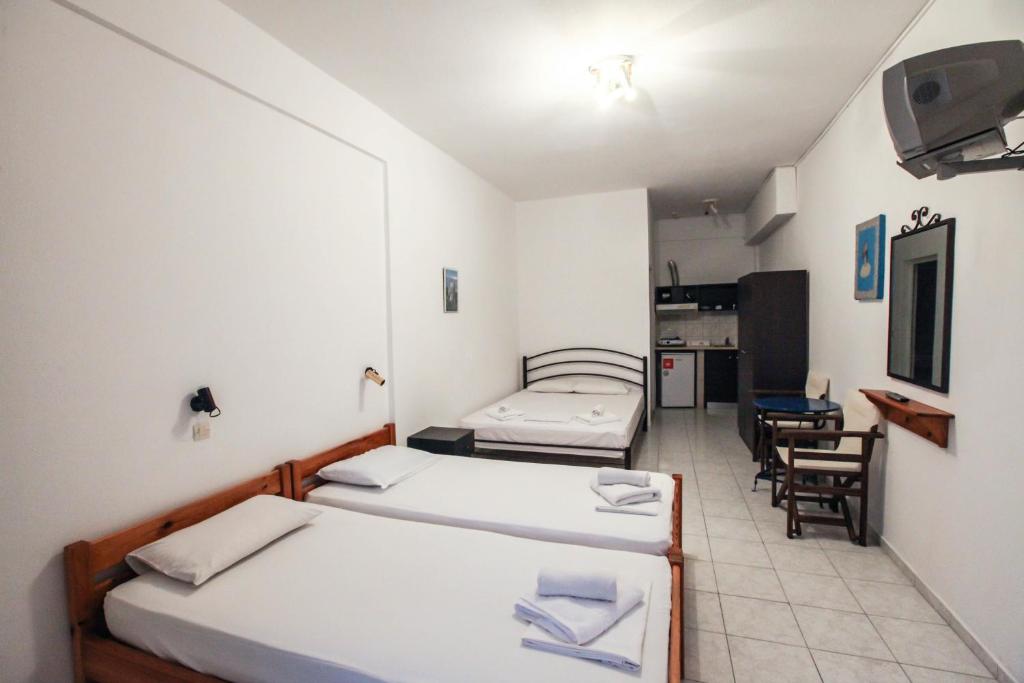 Postel nebo postele na pokoji v ubytování Skentos Hotel