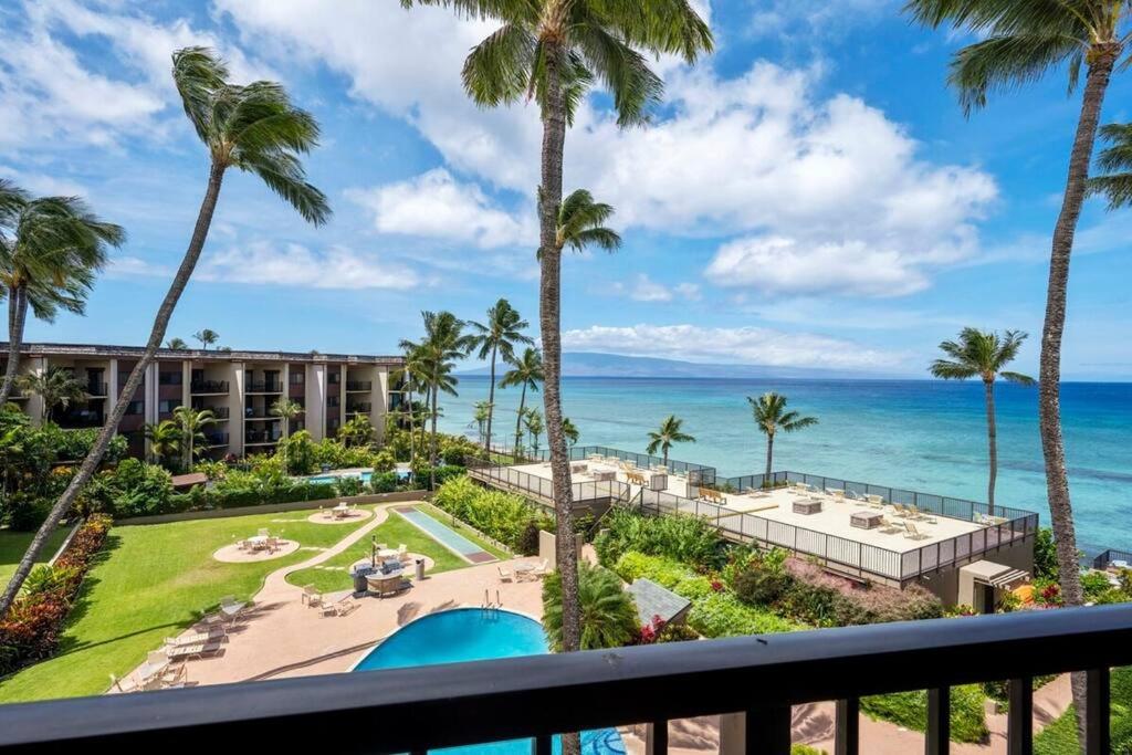 a view of the ocean from the balcony of a resort at Hale Ono Loa 403- Top floor, Ocean view, & complete modern remodel in Kahana