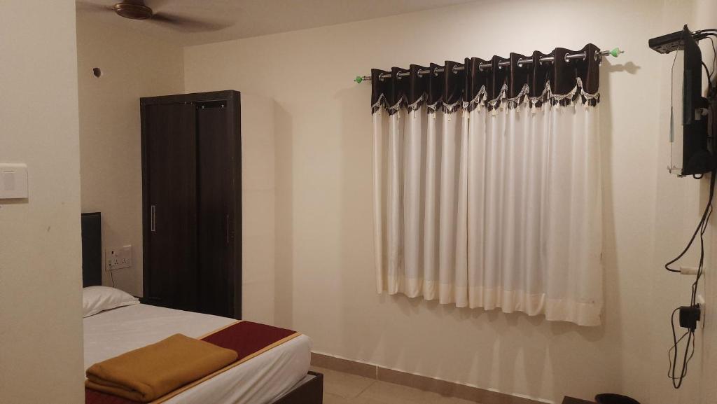 Postel nebo postele na pokoji v ubytování Hotel Sitar Grand