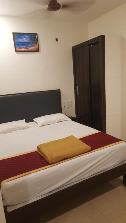 Postel nebo postele na pokoji v ubytování Hotel Sitar Grand