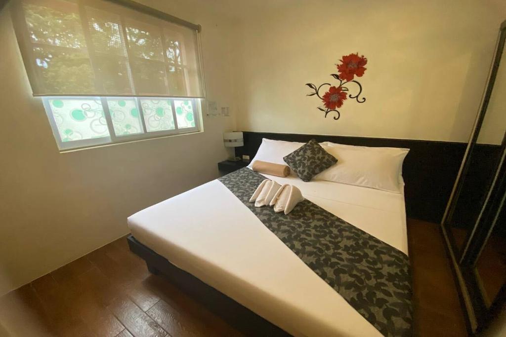 Postel nebo postele na pokoji v ubytování Micasa Lodge Palawan