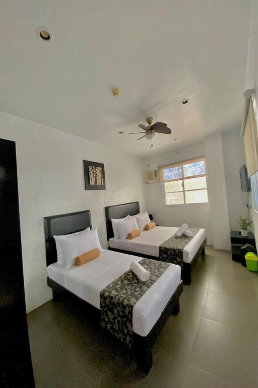 Postel nebo postele na pokoji v ubytování Micasa Lodge Palawan