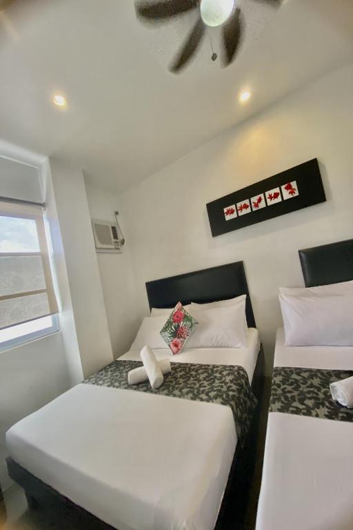 Postel nebo postele na pokoji v ubytování Micasa Lodge Palawan