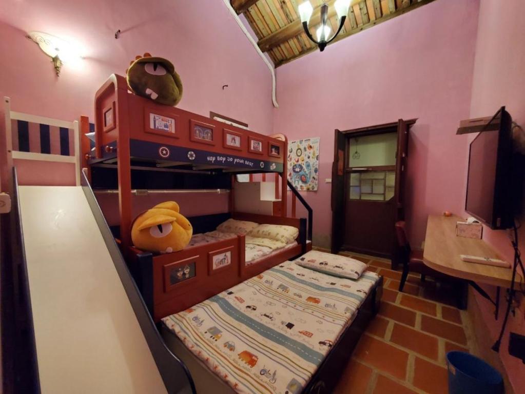 Postel nebo postele na pokoji v ubytování 歇會兒民宿兒童館