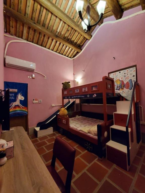 Postel nebo postele na pokoji v ubytování 歇會兒民宿兒童館