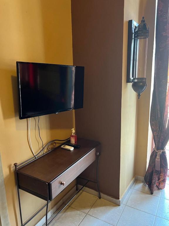 TV a/nebo společenská místnost v ubytování AMFITRION CITY