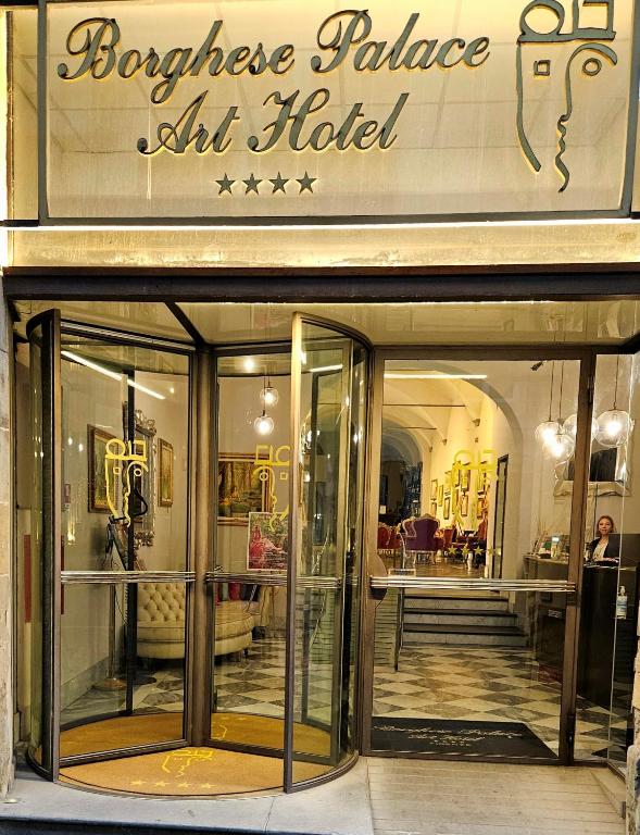 a store front with glass doors in a building at Borghese Palace Art Hotel in Florence