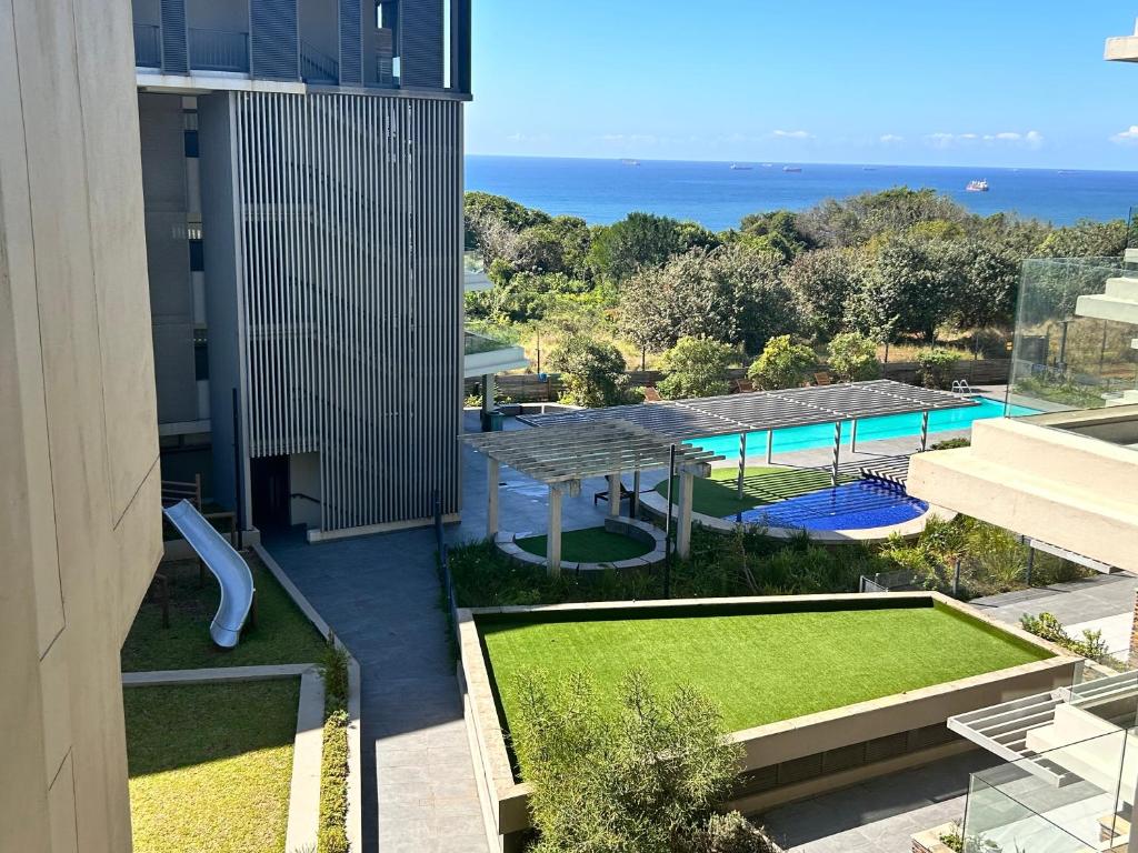 an external view of a building with a swimming pool at Fez@143Oceandune in Umhlanga