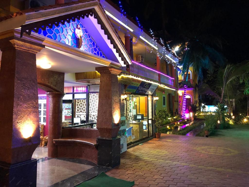 a building with a balcony with purple lights on it at Veronica By The Beach Calangute in Calangute