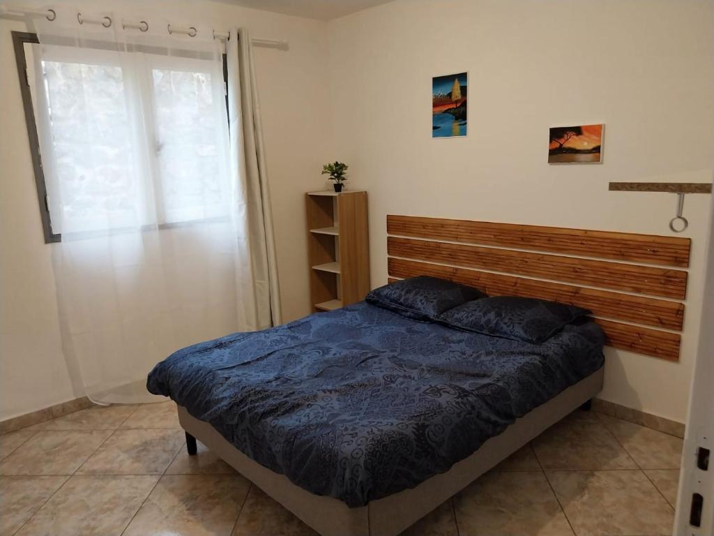 Кровать или кровати в номере Charmante villa créole