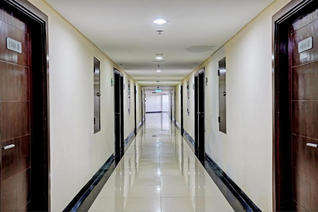 a hallway of a hospital with doors and a long aisle at OYO Life 93097 Apartemen Gateway Pasteur By Kaisar Room in Bandung