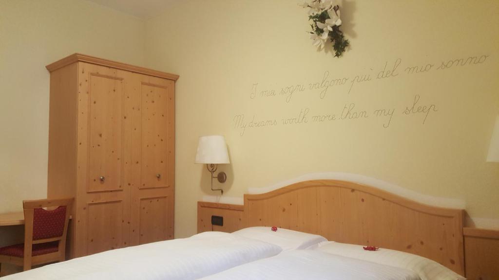 Postel nebo postele na pokoji v ubytování Hotel del Bosco