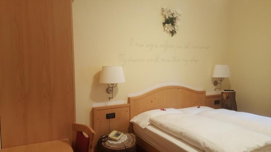 Postel nebo postele na pokoji v ubytování Hotel del Bosco
