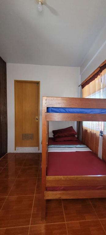 Postel nebo postele na pokoji v ubytování La Vida Hostel