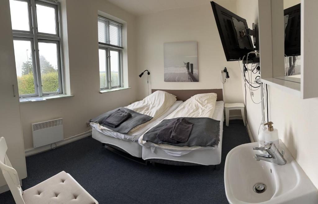 Postel nebo postele na pokoji v ubytování Grenaa Hostel