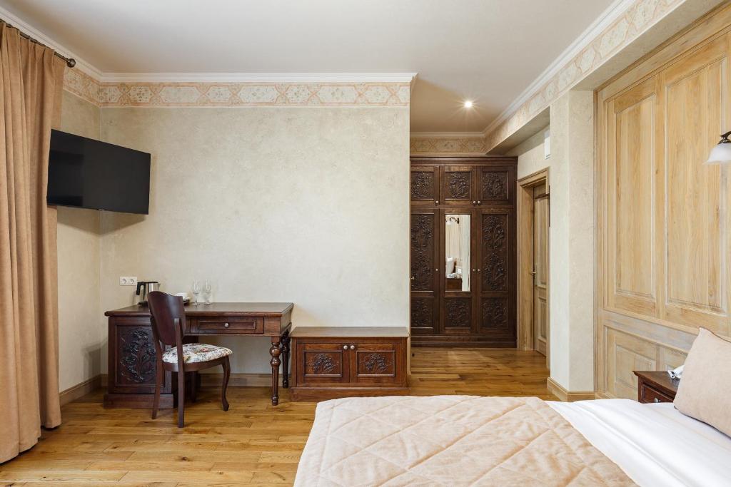 Postel nebo postele na pokoji v ubytování GANZ HOTEL