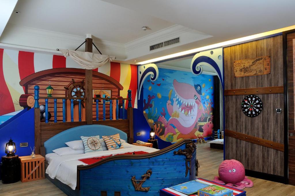 a bedroom with a pirate themed room with a bed at E-DA Royal Hotel in Dashu