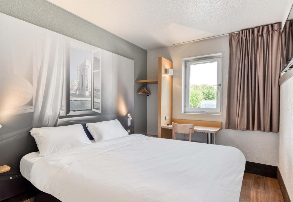 Postel nebo postele na pokoji v ubytování B&B HOTEL Montpellier 1