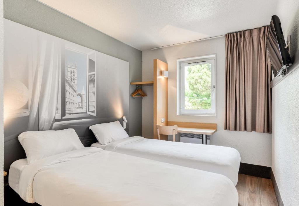 Postel nebo postele na pokoji v ubytování B&B HOTEL Montpellier 1