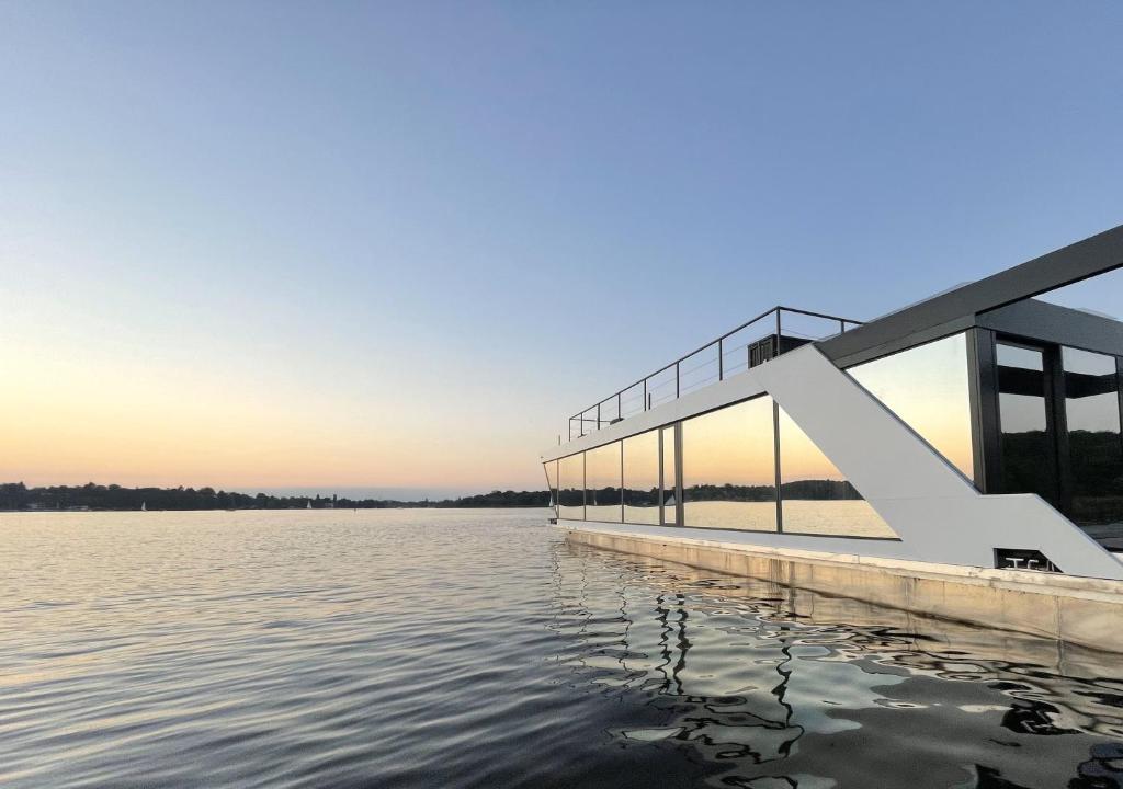 a house on the water at sunset at AQVA The Exclusive Water Loft in Venice in Venice