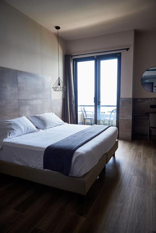 Postel nebo postele na pokoji v ubytování Hotel Concorde