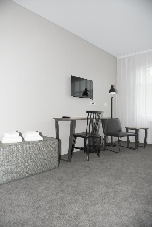 Sjónvarps- og/eða afþreyingartæki á Bella Apartments & Rooms