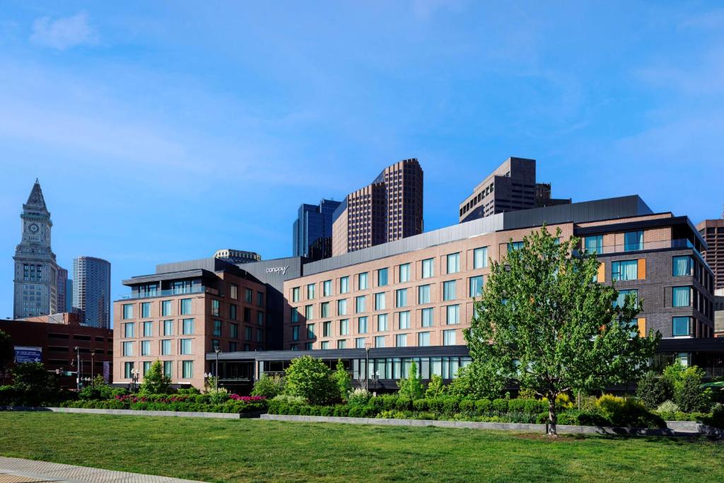 a large building with a clock tower in a city at Canopy By Hilton Boston Downtown in Boston