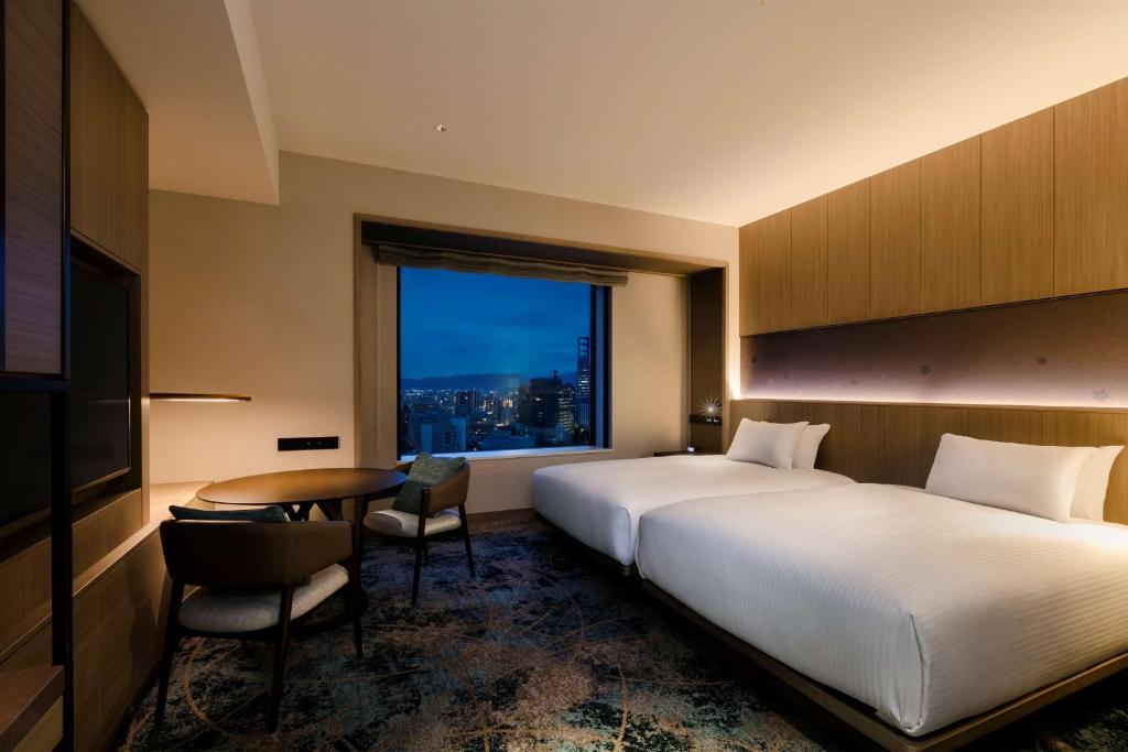 Postel nebo postele na pokoji v ubytování Hilton Hiroshima