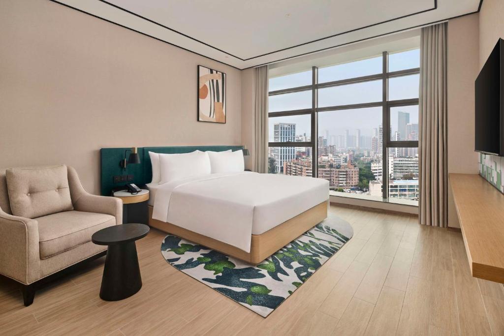 Postel nebo postele na pokoji v ubytování Hilton Garden Inn Zhuhai Jinan University