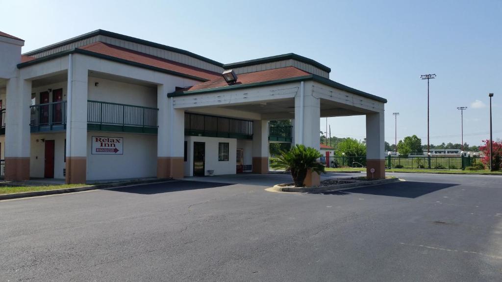 a parking lot in front of a building at Relax Inn in Albany