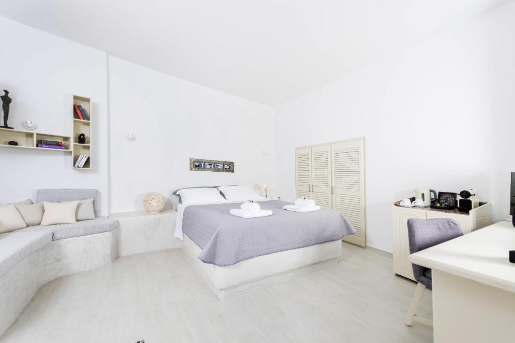 Postel nebo postele na pokoji v ubytování Ambition Suites