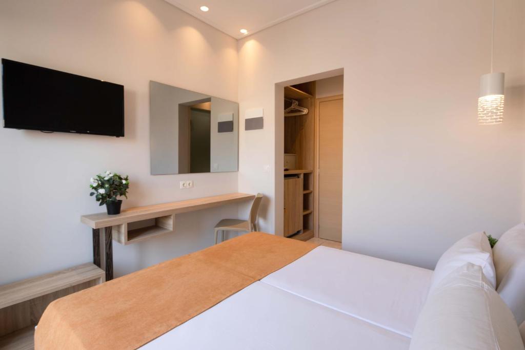 TV a/nebo společenská místnost v ubytování Hotel Rossis