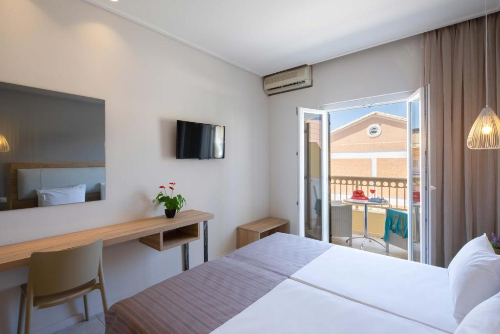 Postel nebo postele na pokoji v ubytování Hotel Rossis