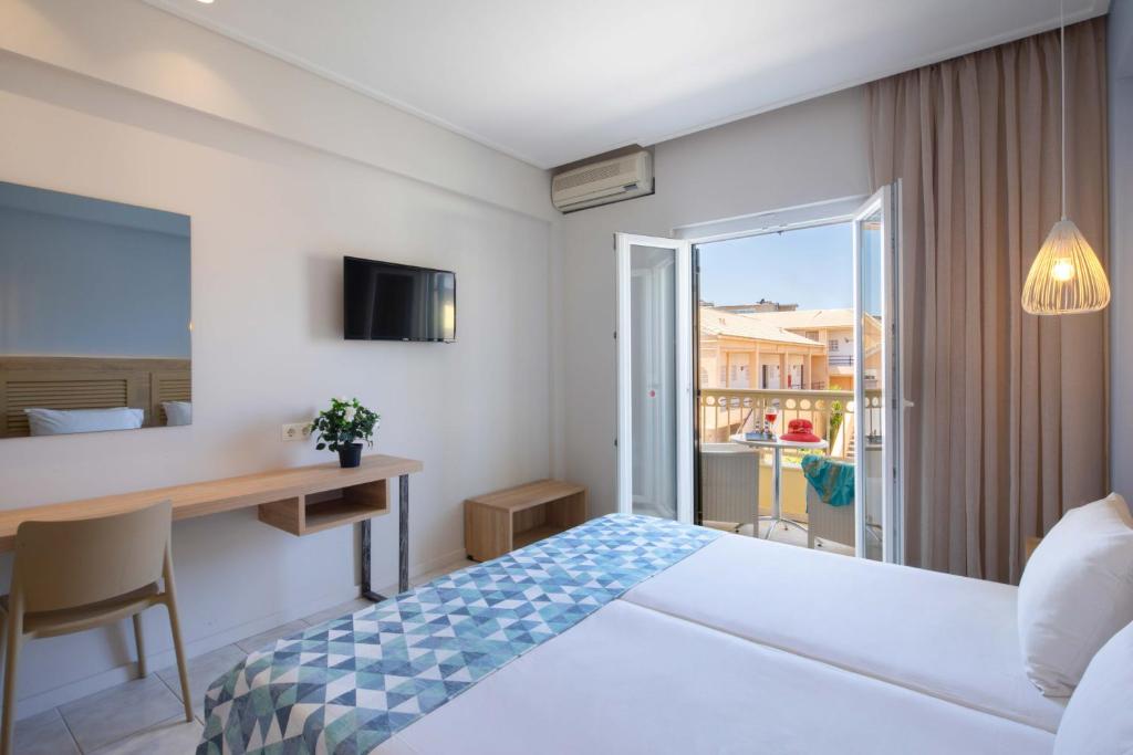 Postel nebo postele na pokoji v ubytování Hotel Rossis