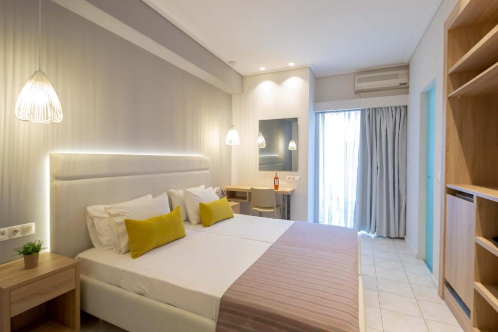 Postel nebo postele na pokoji v ubytování Hotel Rossis
