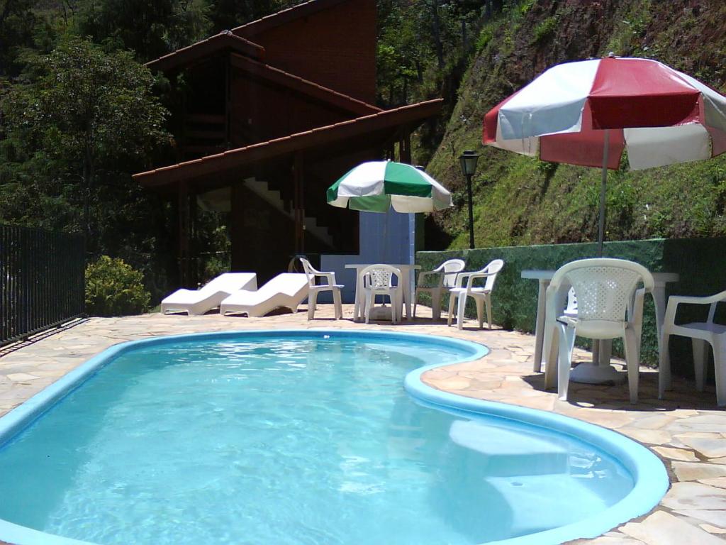 Swimmingpoolen hos eller tæt på Chalés Pousada Serra Negra
