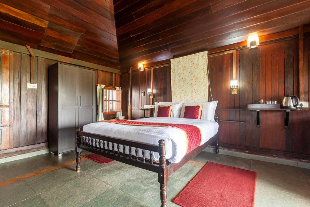 Postel nebo postele na pokoji v ubytování Deshadan's Tarangi Beach Villas,Marari