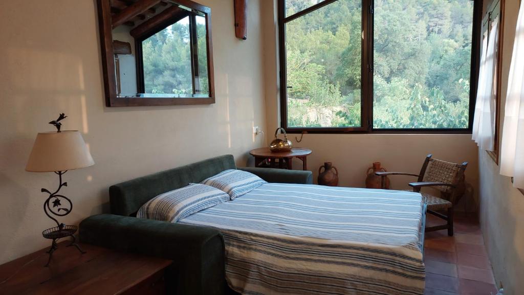 Cama o camas de una habitación en La Calma Montblanc Prenafeta