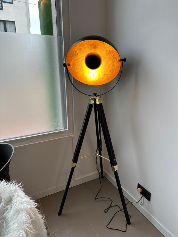 a light on top of a tripod in a room at Antwerp West Side in Zwijndrecht