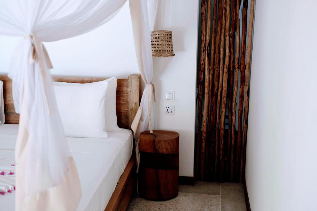 Postel nebo postele na pokoji v ubytování Boutique Villa Unaweza