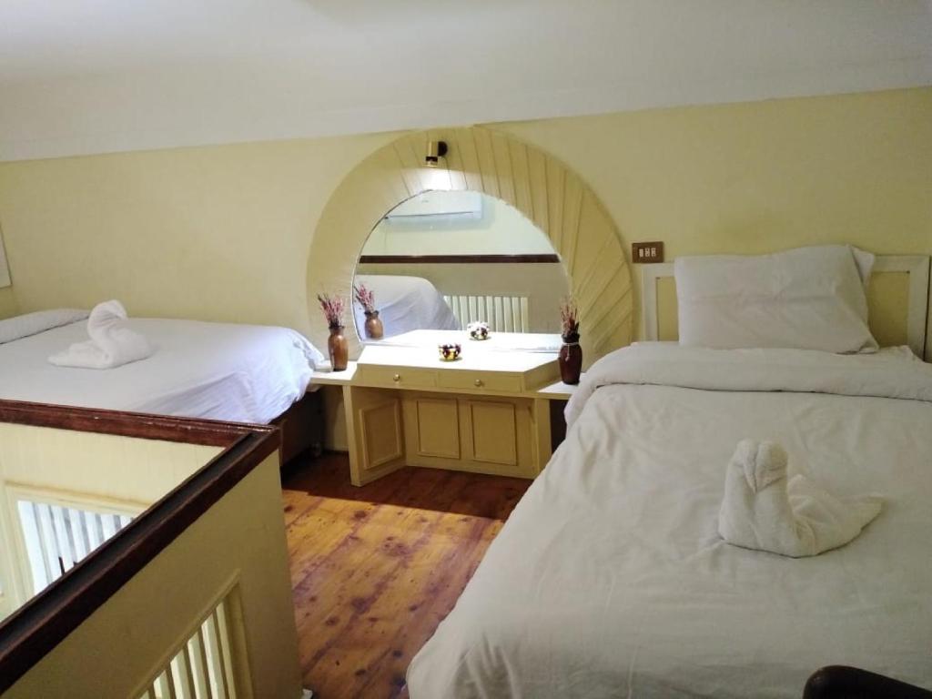 Postel nebo postele na pokoji v ubytování Hotel Panorama