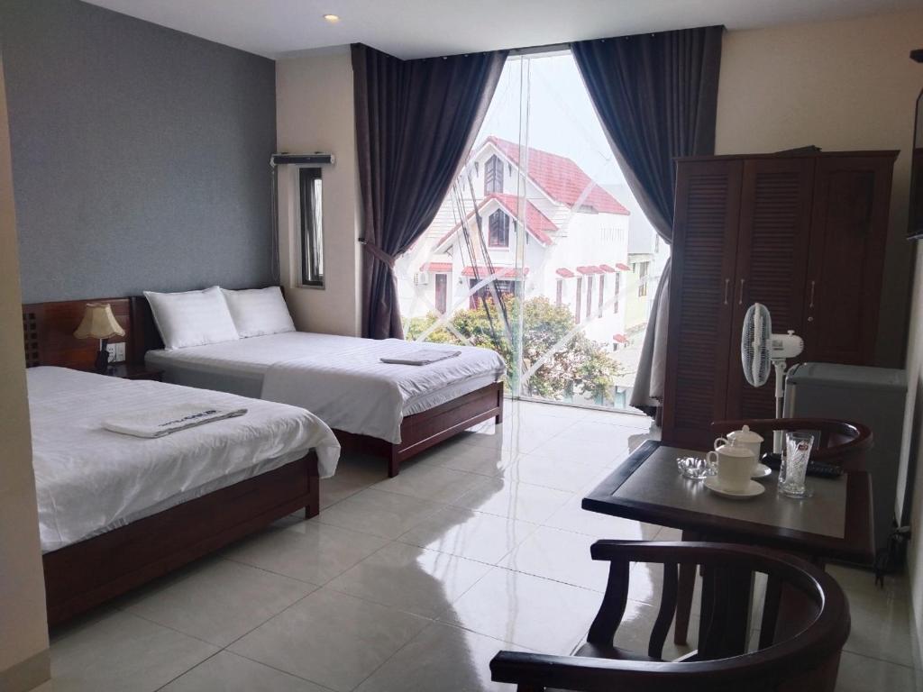 Postel nebo postele na pokoji v ubytování GOLD Hotel